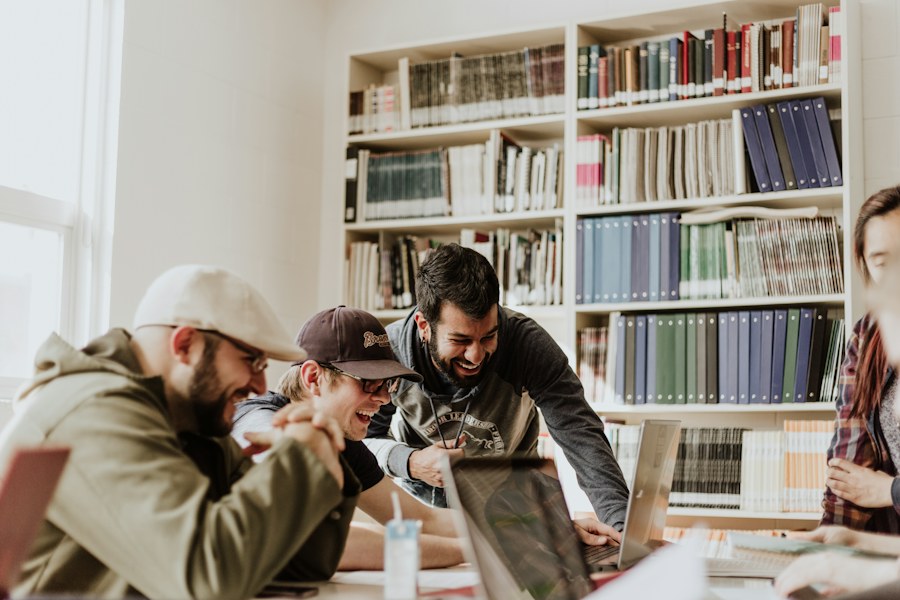 Students exchanging ideas at a library table